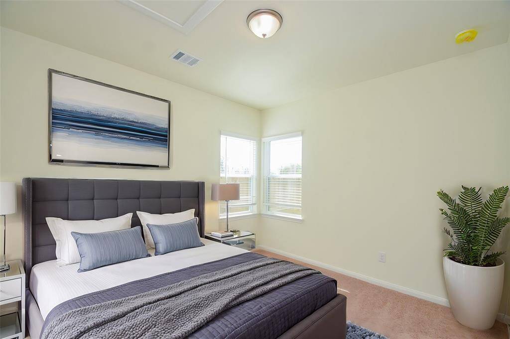 Discover the comfort and potential of this well-lit bedroom.