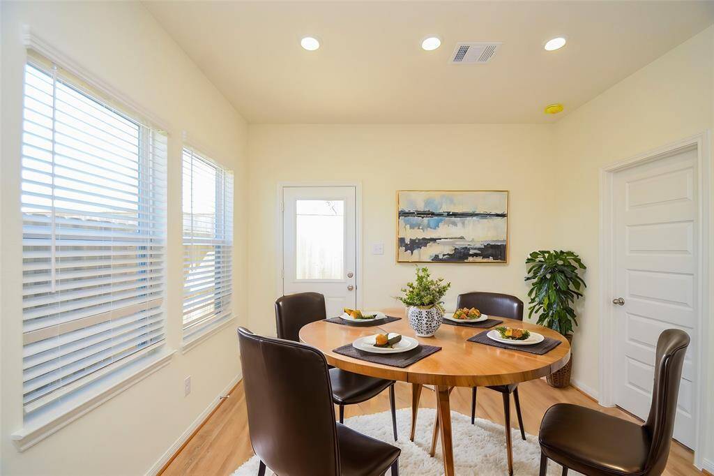 Step into this inviting and sun-drenched dining area.