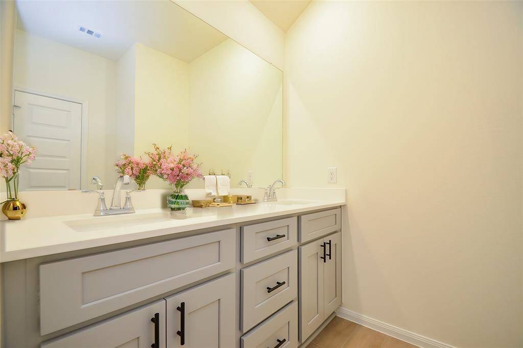 Notice the gray cabinetry and beautiful countertops, which are perfect for storage.