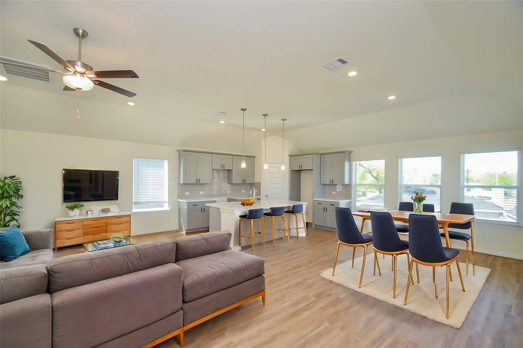 Notice the seamless flow between the living area and other spaces, creating a sense of spaciousness.