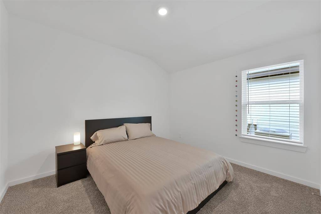 One of the bedrooms just off the hallway from the den