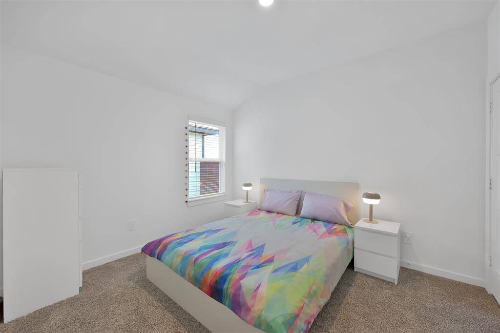 One of the bedrooms just off the hallway from the den