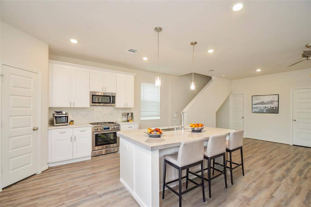 Step into this stunning and contemporary kitchen, the heart of this beautiful home.