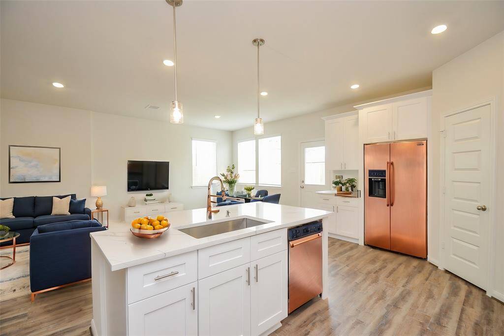The expansive center island provides a fantastic workspace and a natural gathering point.