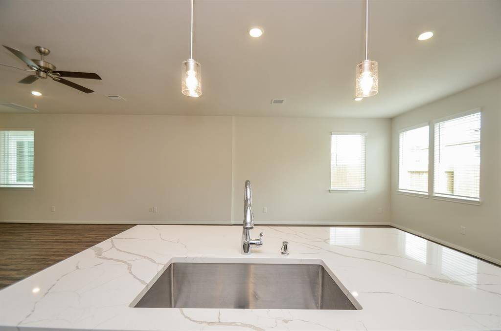 Imagine entertaining in this open-concept kitchen that seamlessly blends with the living areas.