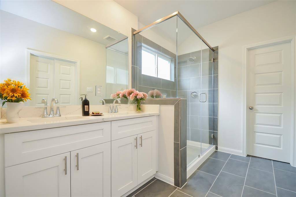 Indulge in modern elegance of this well-appointed bathroom.