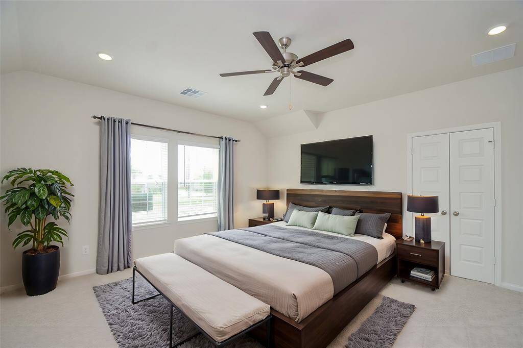 Discover this generous sized primary bedroom that offers ample space to showcase your personal style.