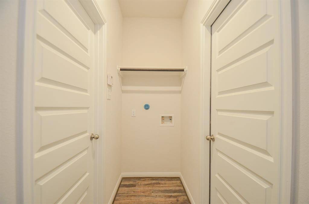 This spacious utility room is perfect for laundry necessities.