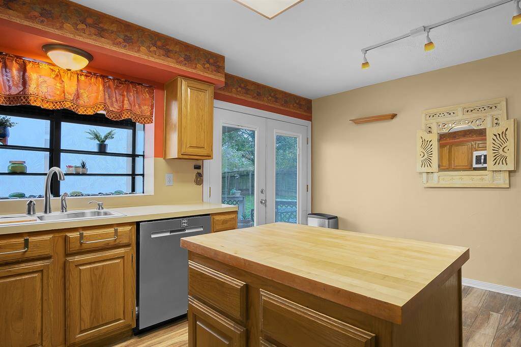 Additional view of the kitchen overlooking the breakfast area.
