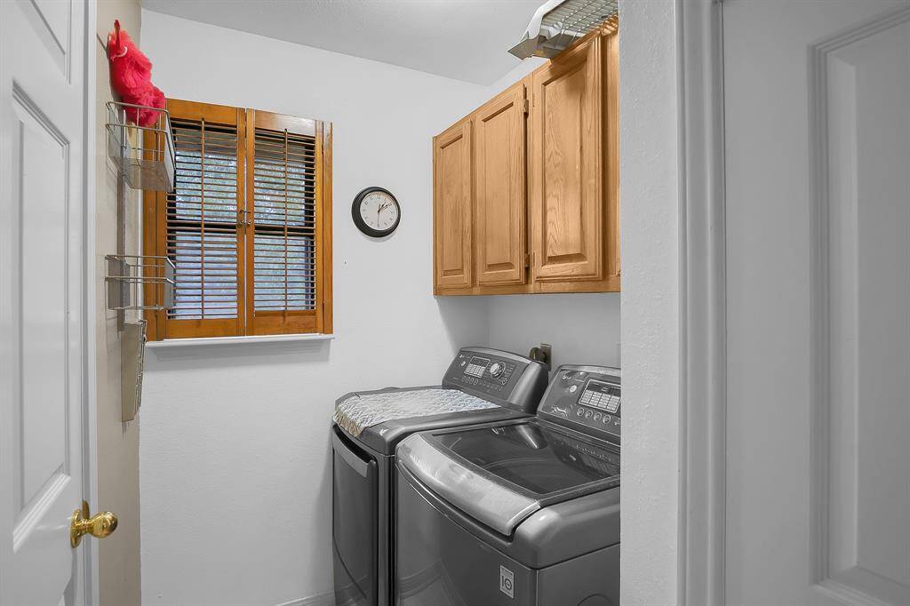 The utility room has plenty of additional storage complete with overhead cabinets and a linen closet. Washer & Dryer to stay!!!