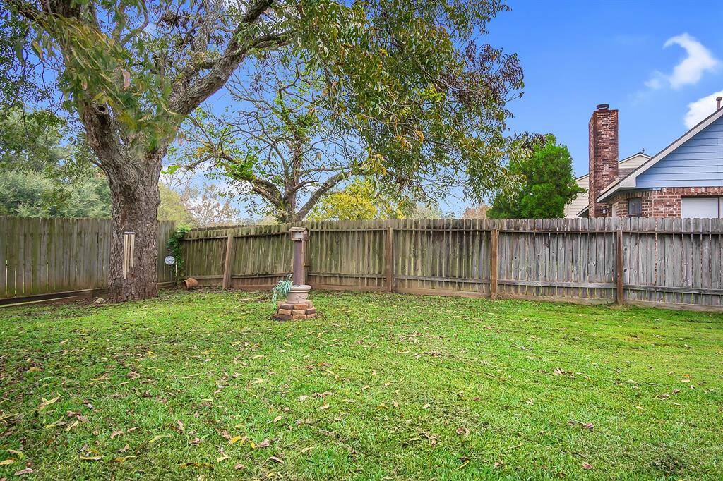 Enjoy outdoor entertaining in this large backyard with no back neighbors!
