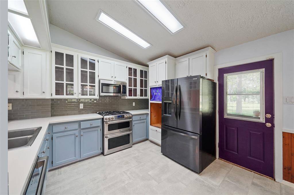 Sleek white cabinets and newly replaced flooring.