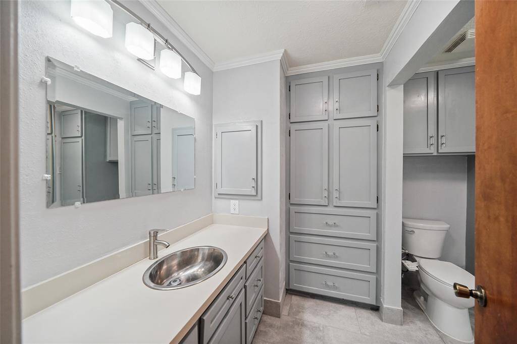 Newly remodeled bathroom with built-in shelves and other new features.