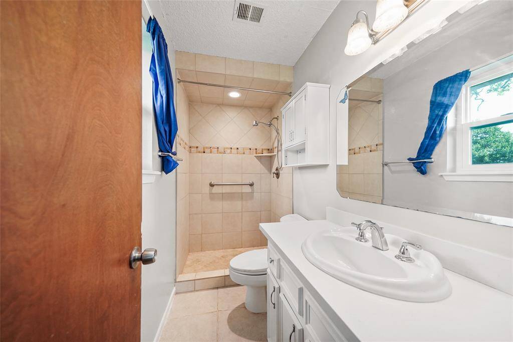 Full secondary bathroom with walk-in shower
