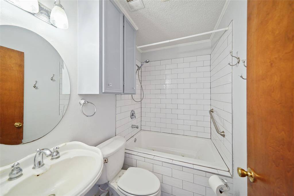Neat and very bright secondary bathroom.