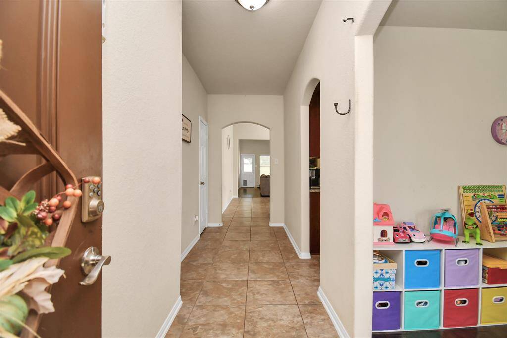 As you step inside, you’ll be greeted by an open-concept.