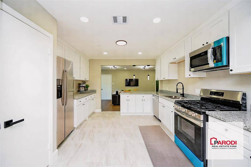 The freshly painted walls in soft colors create a perfect blank canvas for you to express your personal style and add your special touch! Notice how the kitchen is in middle of the living and dining areas, which is great for entertainers!!
