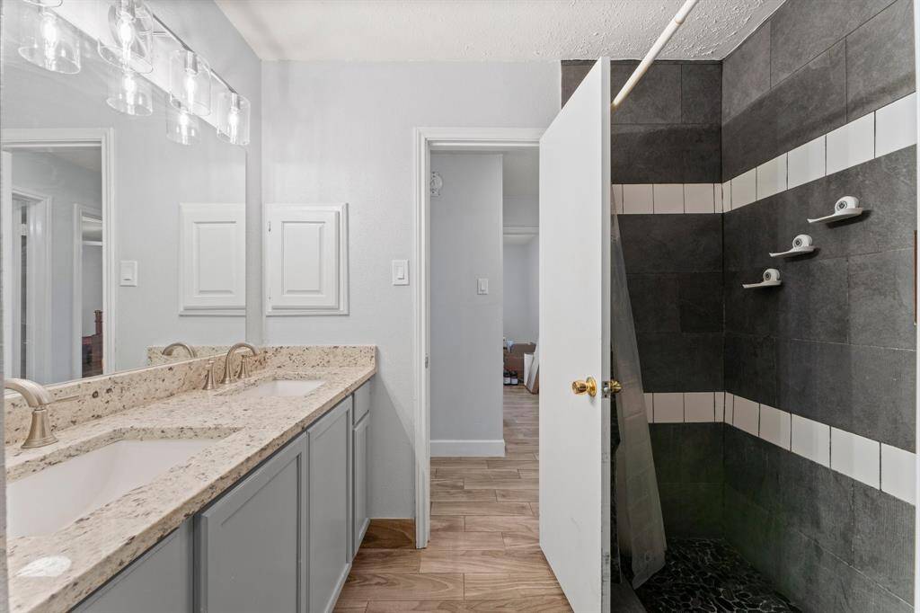 Secondary bathroom with updated shower.