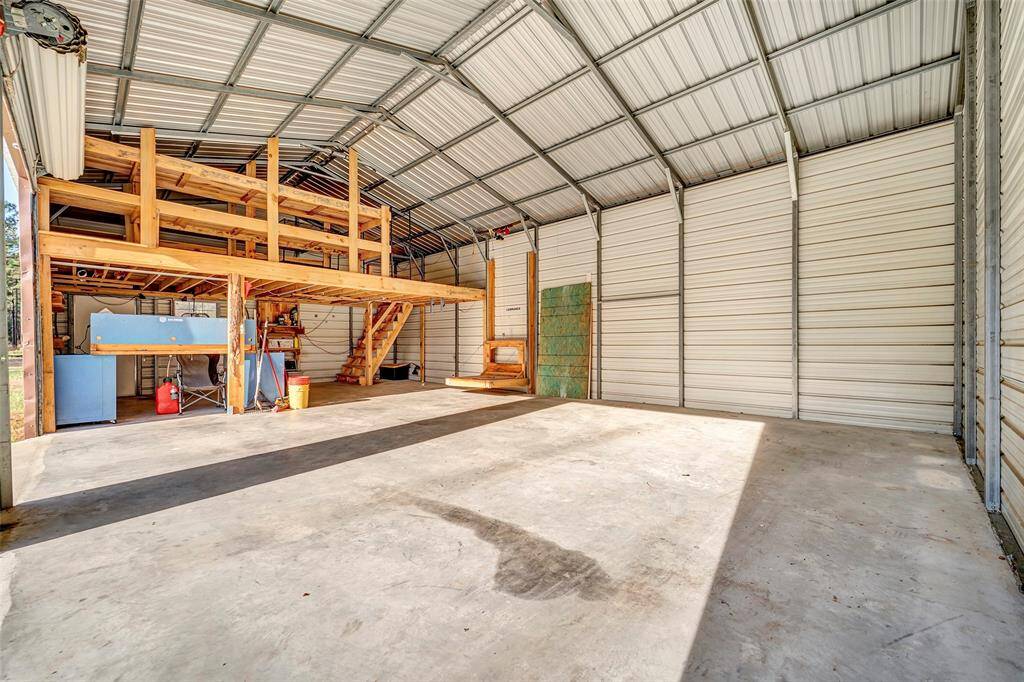 Another angle of the workshop and garage with the lift down