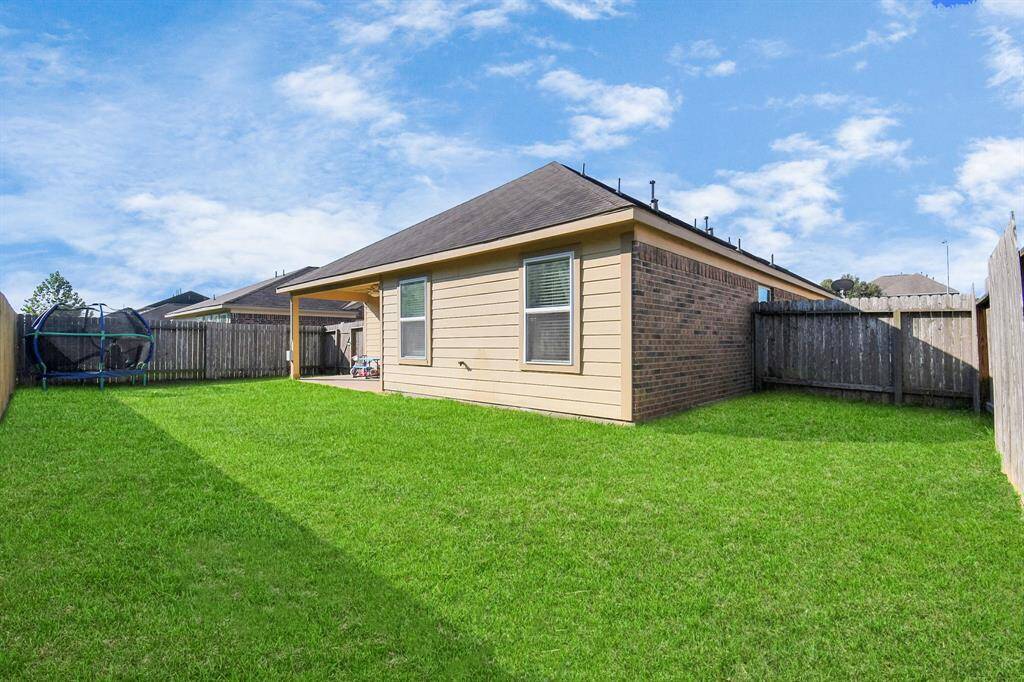 It’s the perfect spot for outdoor relaxation or gatherings, with plenty of green space for pets or play.