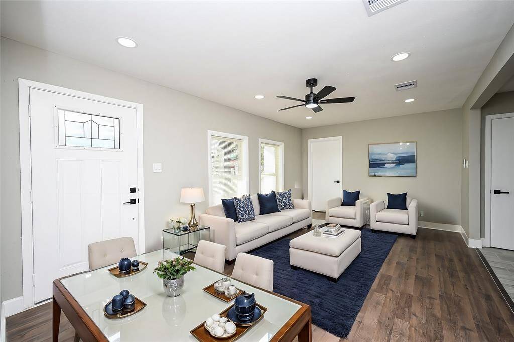 Elegant wood-like flooring adds warmth and sophistication, enhancing the room's overall aesthetics.