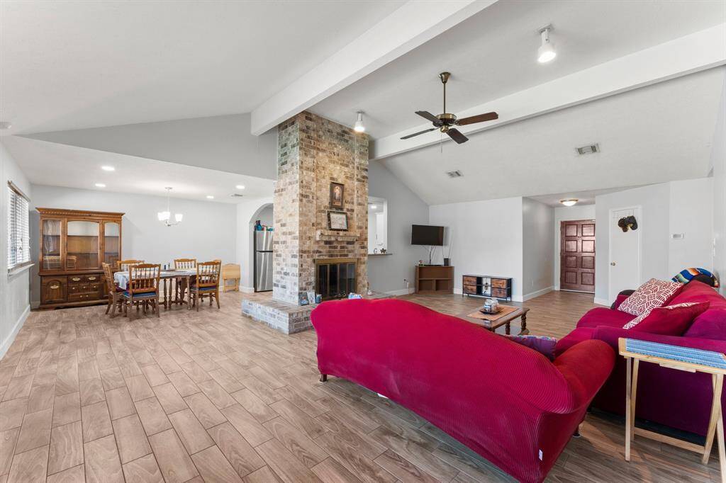Another view of the living area with wood look tile.