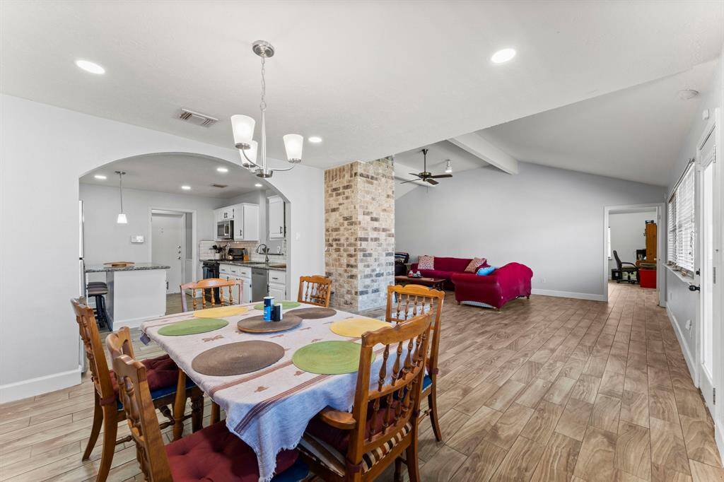 Easy access to the kitchen and dining area from the living room.