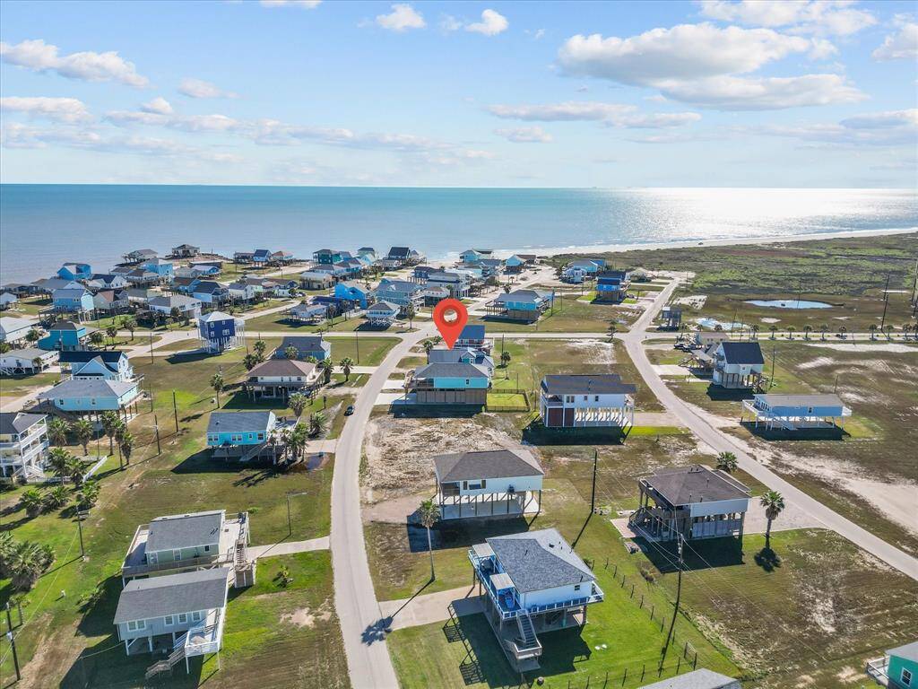 Coastal community with elevated homes, offering a scenic ocean view. The neighborhood features spacious lots and easy beach access, perfect for seaside living.