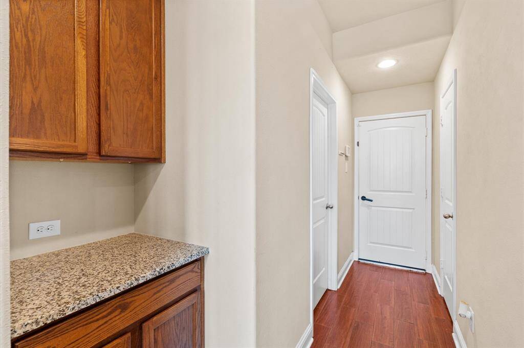 Hall to garage/half bath/ laundry