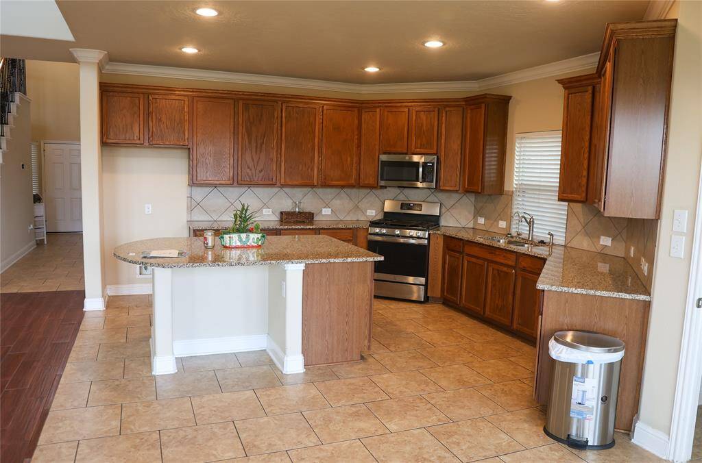 Eat in Kitchen view to the bar seating at island