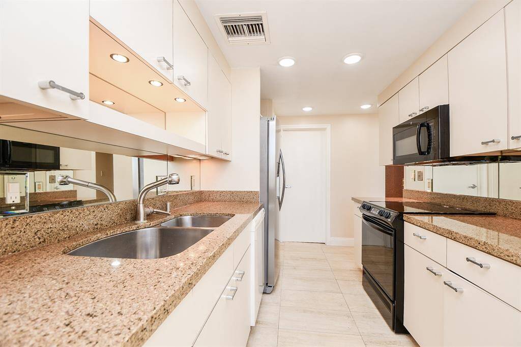 Kitchen with abundant cabinets