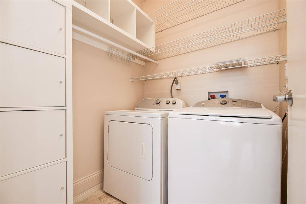 Utility room with abundant storage & large capacity appliances + sensor shuts off water in case of leak
