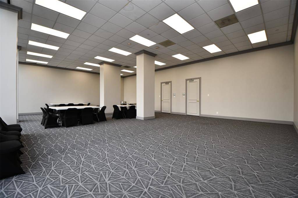 Oversized community room for meetings and parties. Catering kitchen at rear of photo