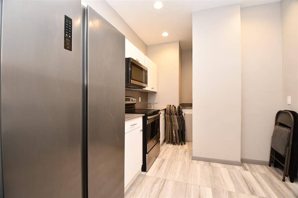 Catering kitchen with refrigerator & stove just off large  community room