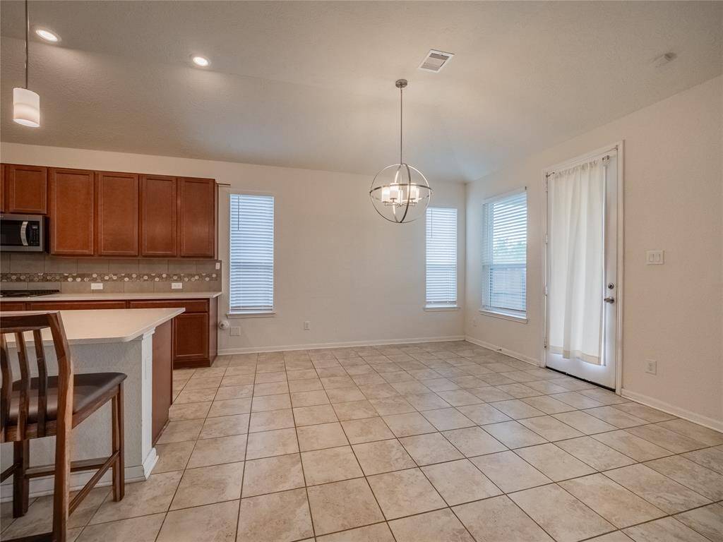 breakfast nook and back door to the covered patio