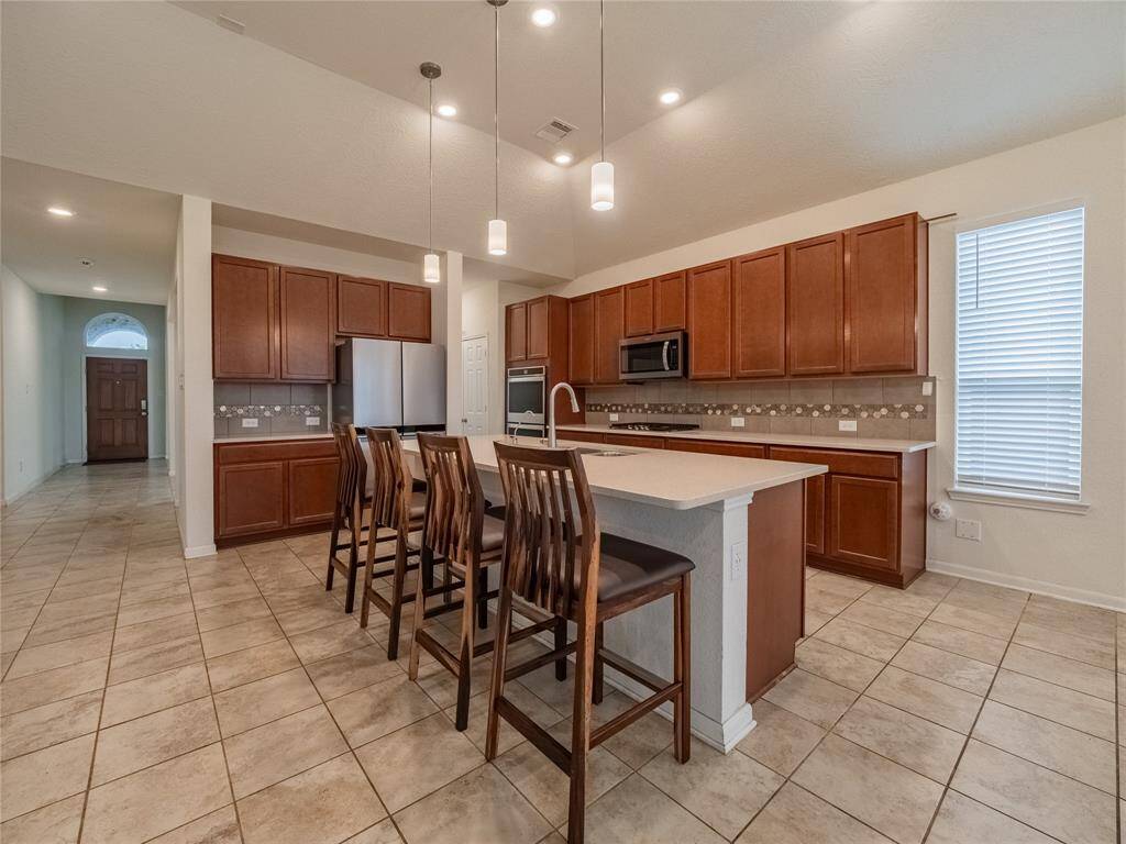 you have your coffee bar next to the fridge and the pantry is between the kitchen and formal dining *** all appliances are top grade and less thann2 years old