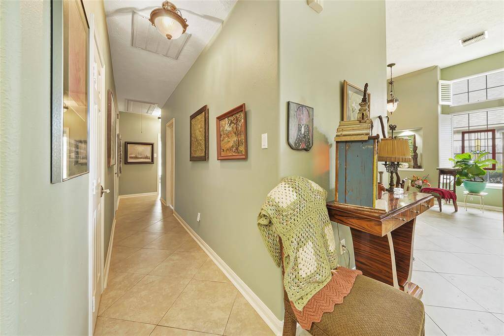 Hallway leading to the guest bedroom, office, and guest bathroom