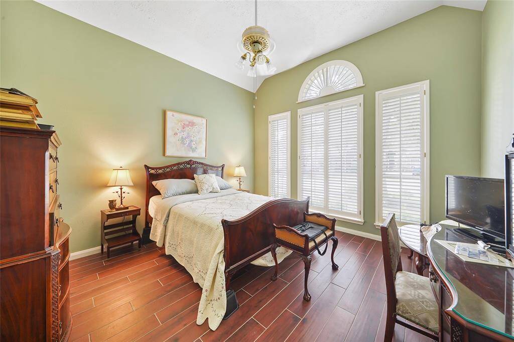 Guest bedroom with high ceilings and plenty of natural light