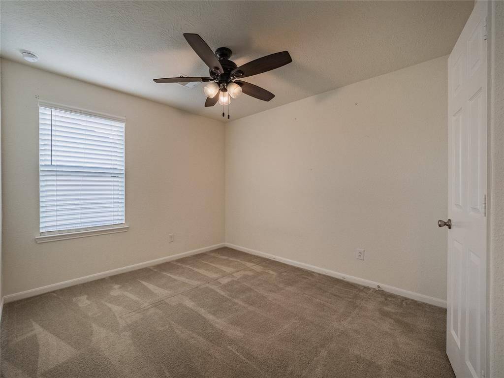 Bedroom 2 upstairs with ceiling fans ( all ceiling fans are Hunter Fans )