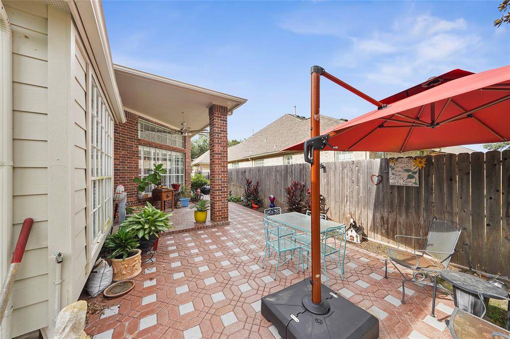 Welcome to the backyard! Nice paved space for seating