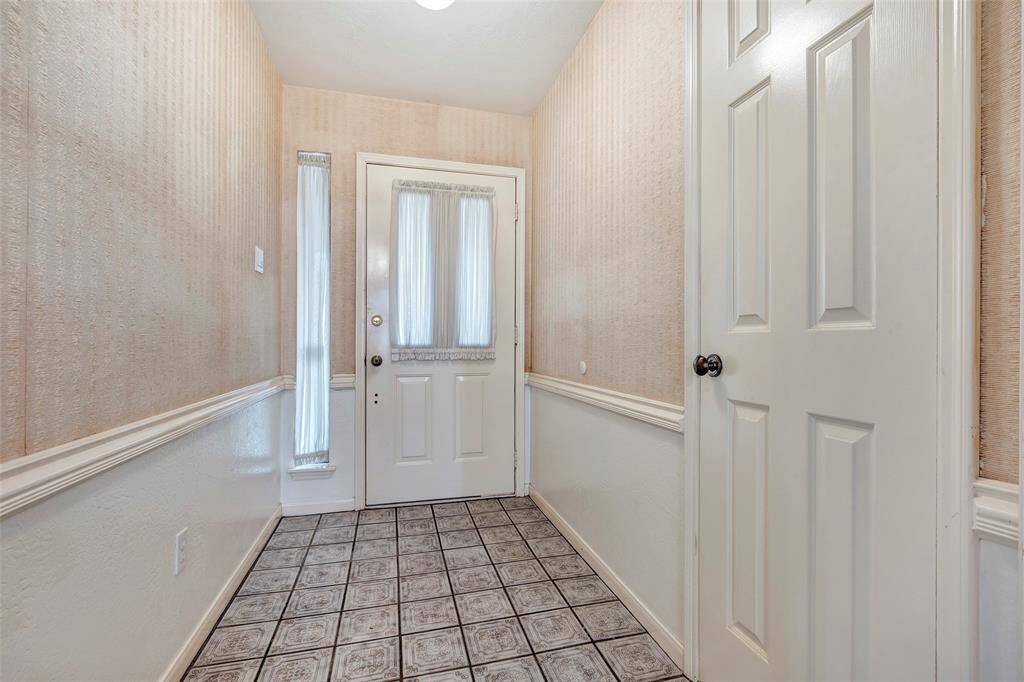 This listing features vaulted ceilings, a spacious layout, and abundant natural light throughout the open living area.