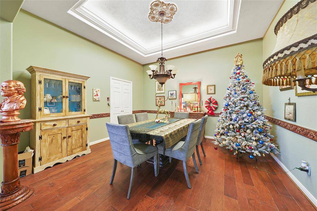 Formal dining room with entry to kitchen and living room