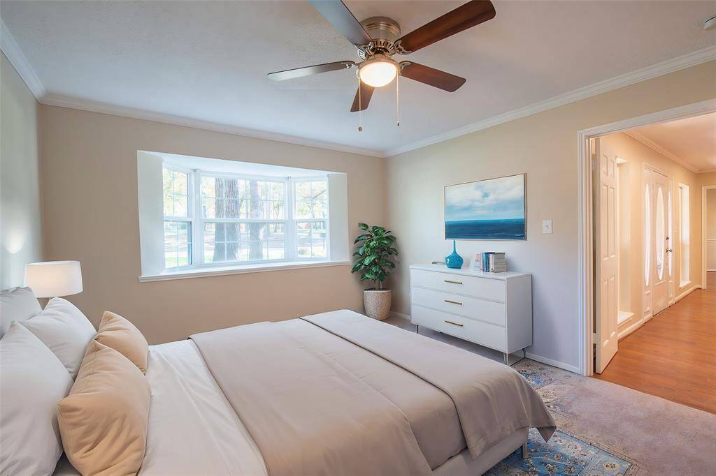This bedroom is located on the first floor just off the entryway and connects to a bathroom. The bathroom connects to the living area and the formal sitting area.