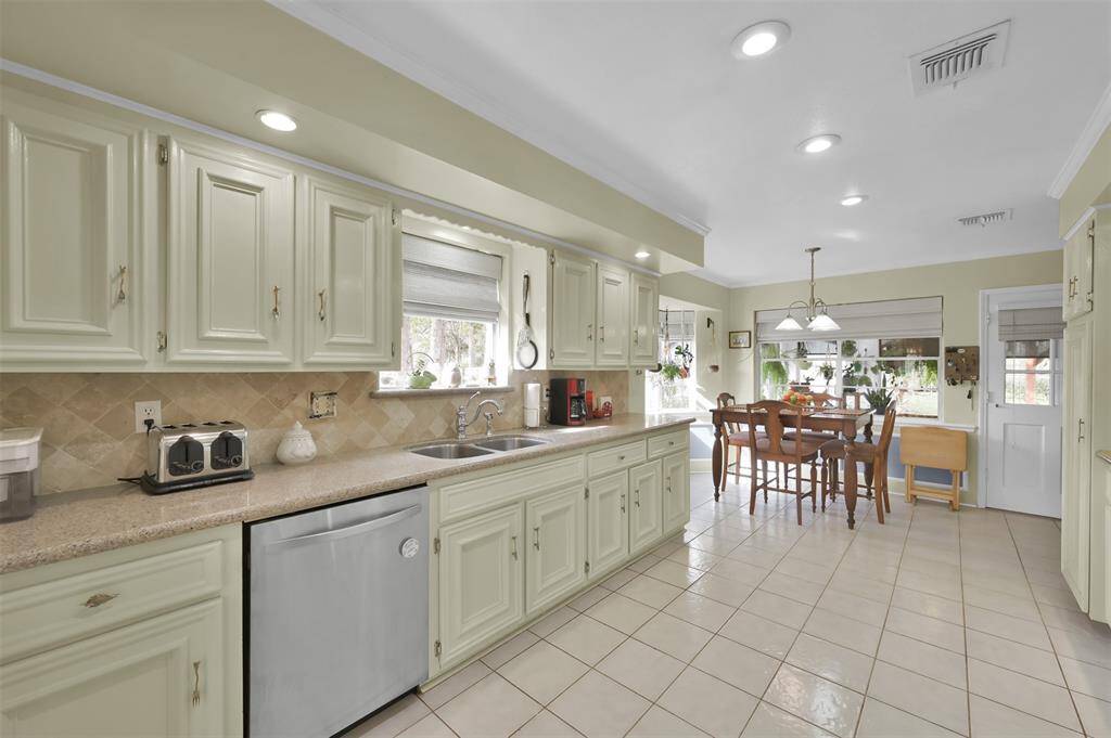 The open layout includes a cozy dining area with large windows, creating a bright and inviting space