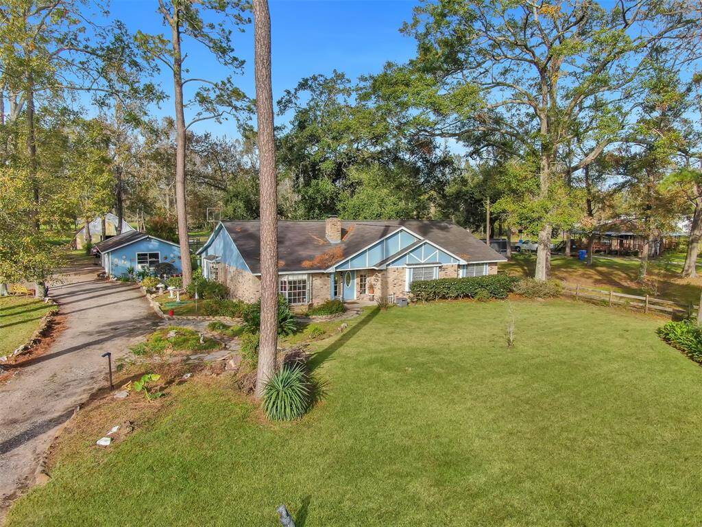 Private gated long driveway leading to detached 3 car garage