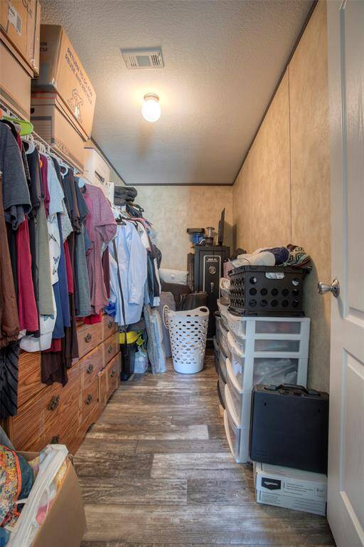 Deep closet in primary bedroom.