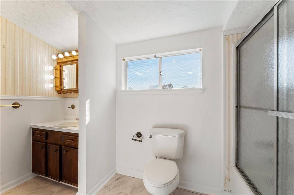 The full bathroom upstairs is complete with a shower/tub combo, closet, AND extra built ins for storage.