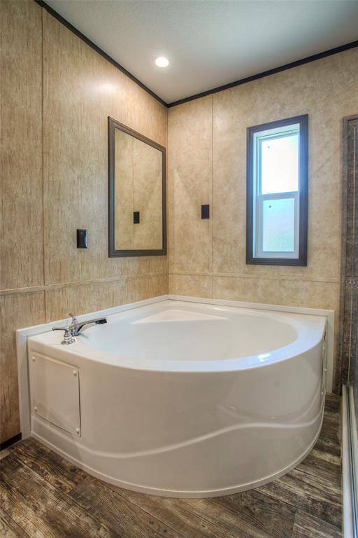 Large, soaking tub in primary bath.