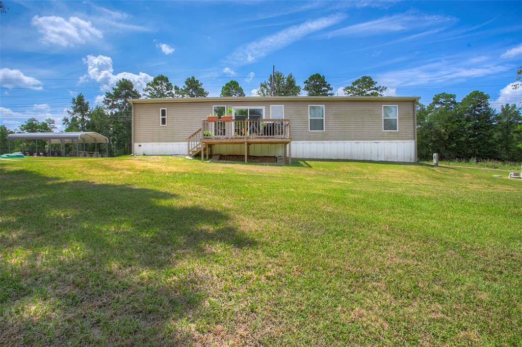 Rear view of the mobile home showcasing the back deck.