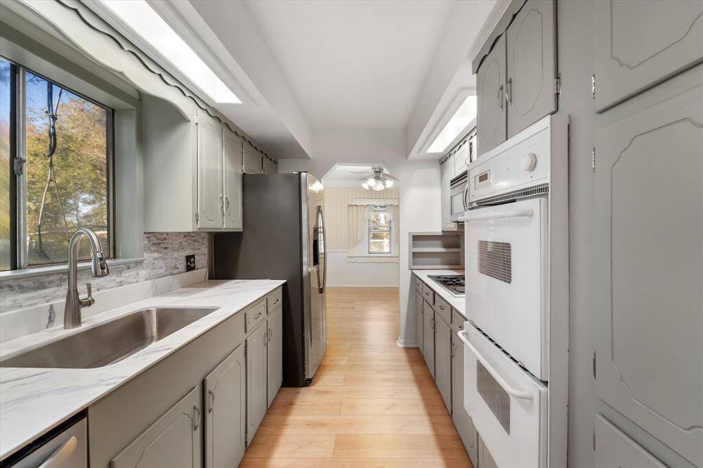 Your kitchen has a large undermount sink and the new GE refrigerator is also included!